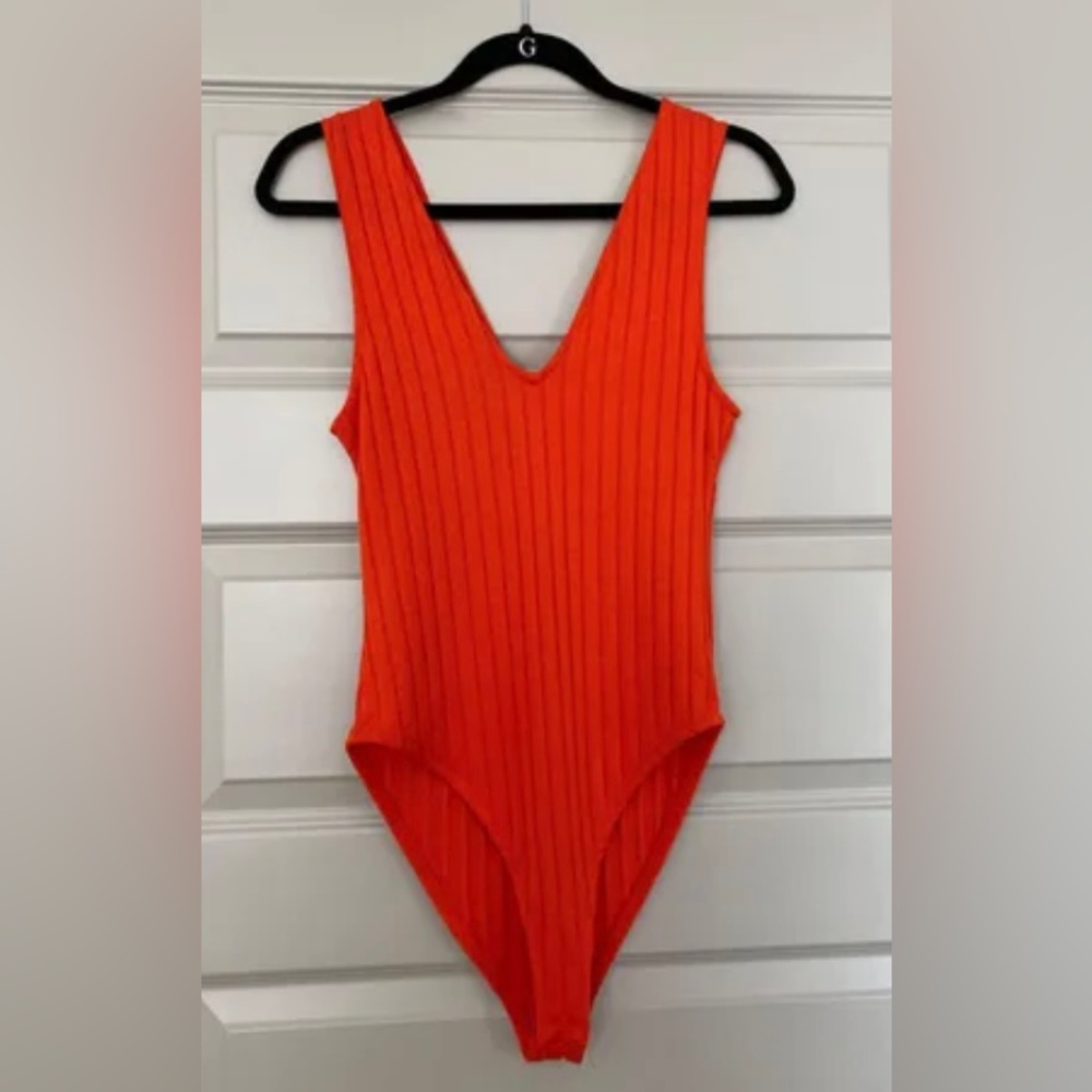 Zara body suit - vibrant orange with buttons at the bottom